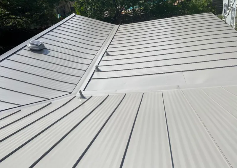 Solar attic fan installed on a metal roof for Roof Ventilation in Gun Barrel City
